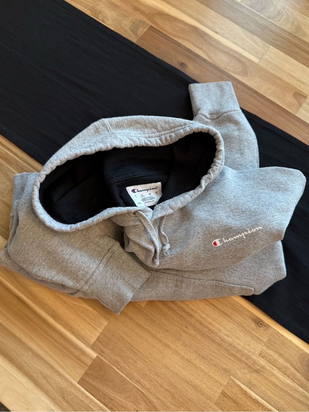 Champion Grey Hoodie with White Label and Red Accent